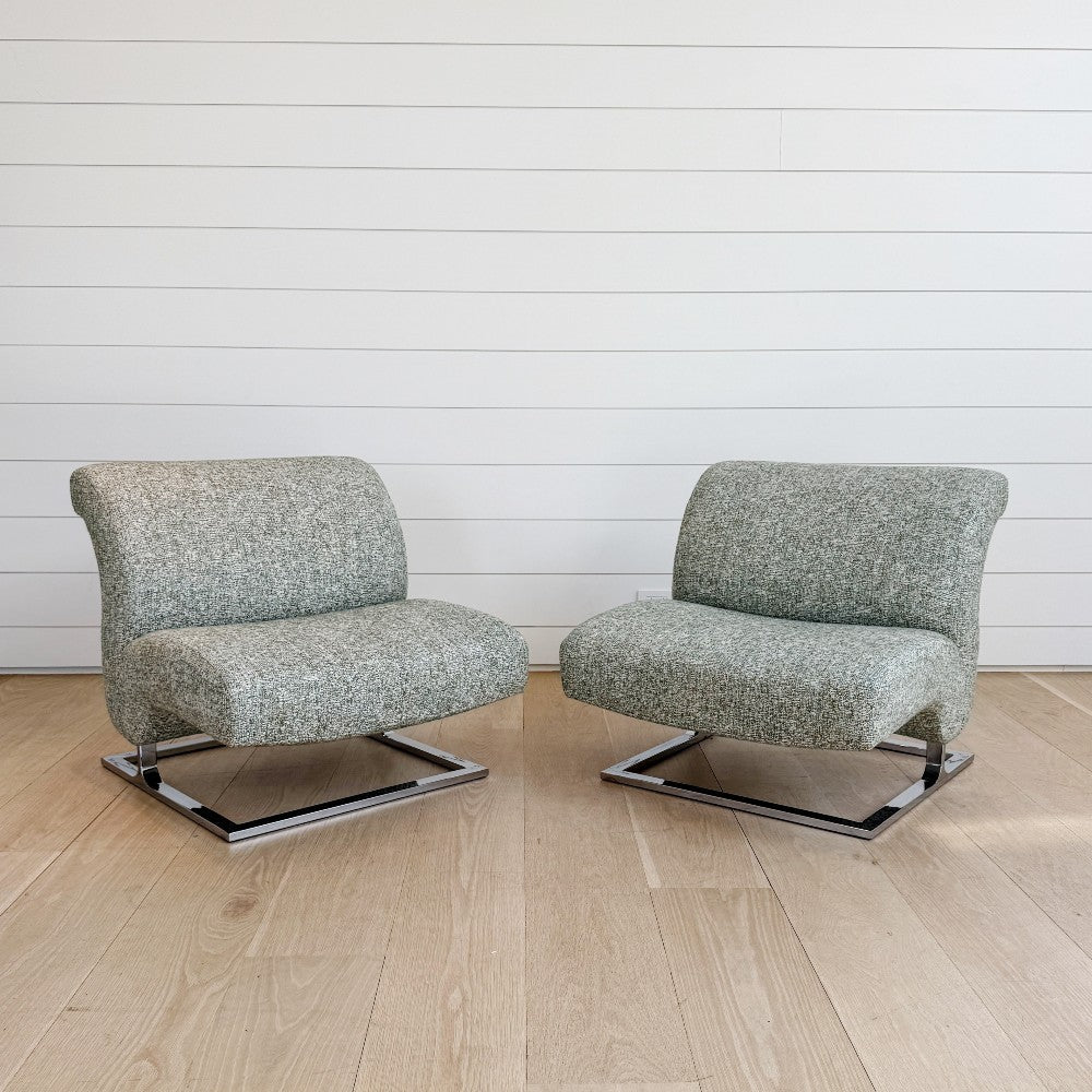 vintage pair of lounge chairs on chrome bases