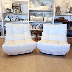 vintage pair of white leather armless chairs