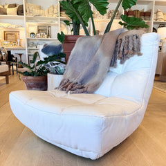 vintage pair of white leather armless chairs