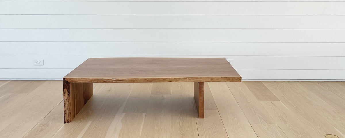 the walnut slab waterfall coffee table